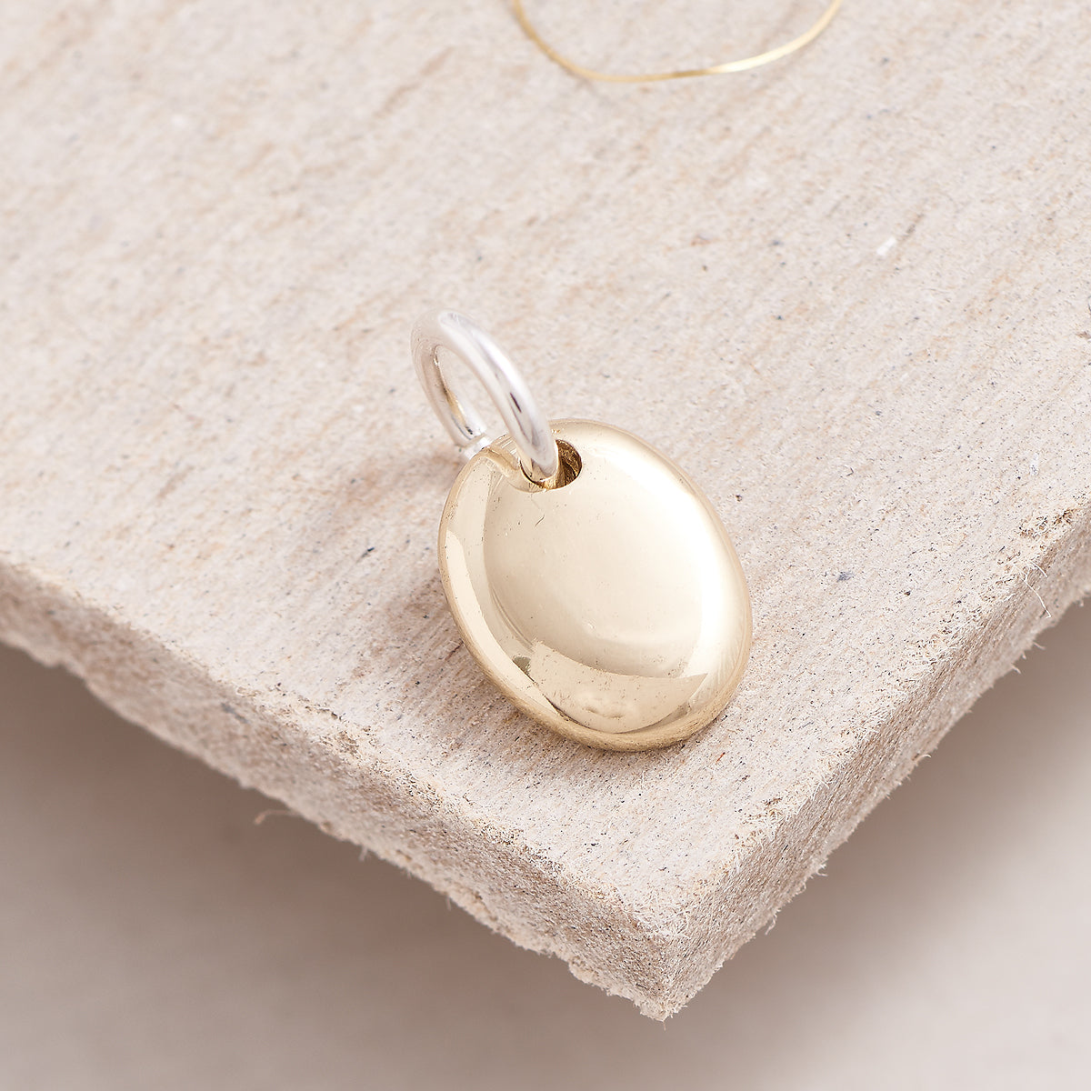 solid gold pebble bracelet charm