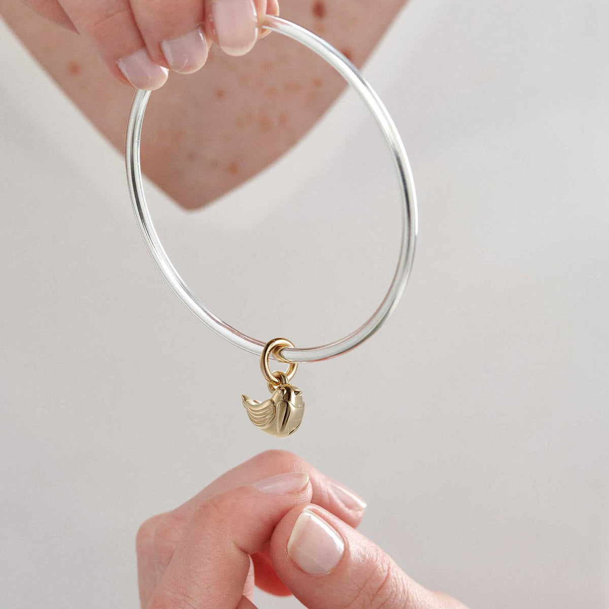 solid gold and silver robin redbreast charm bangle