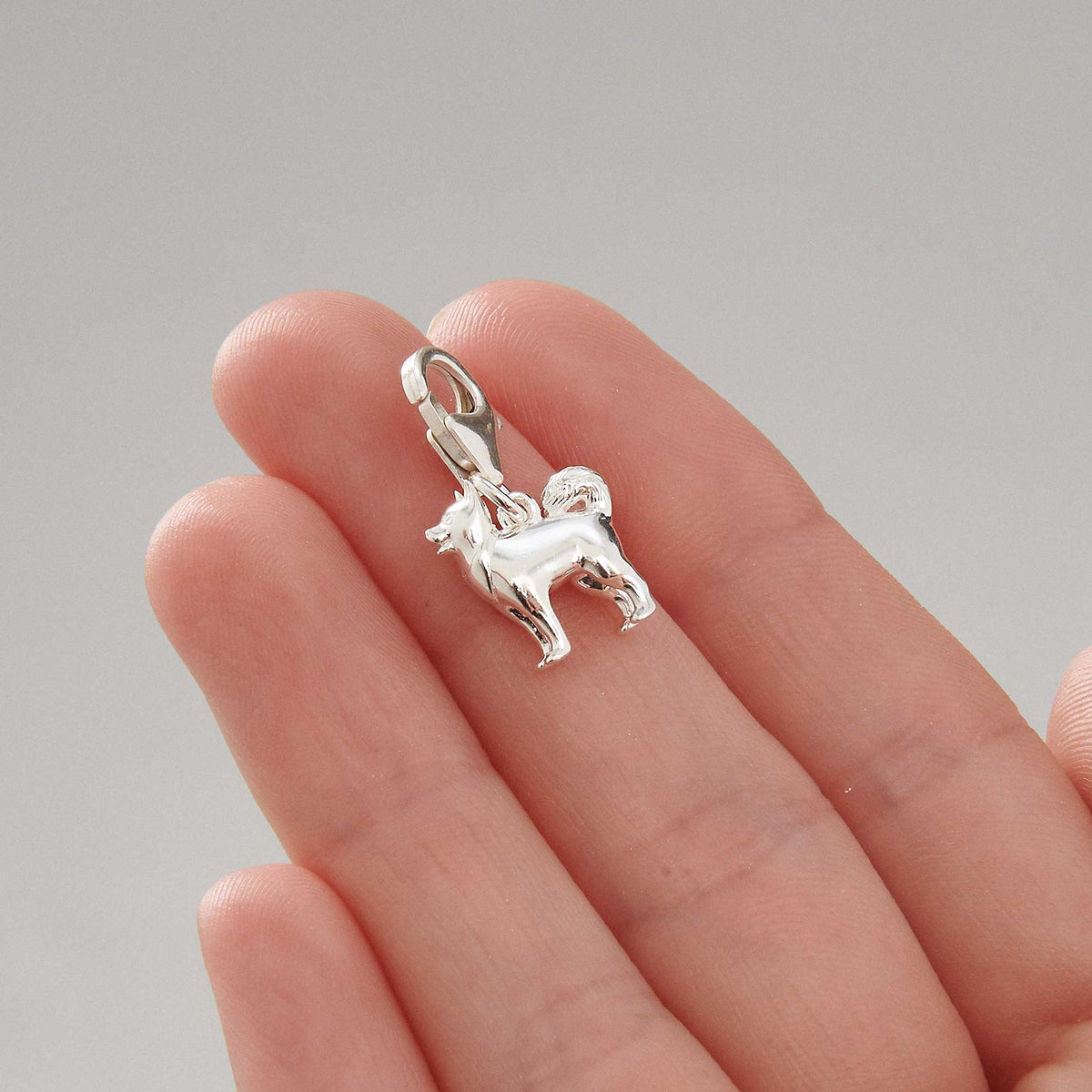 Pomsky mixed dog breed solid sterling silver dog charm with clip on clasp Scarlett Jewellery Ltd