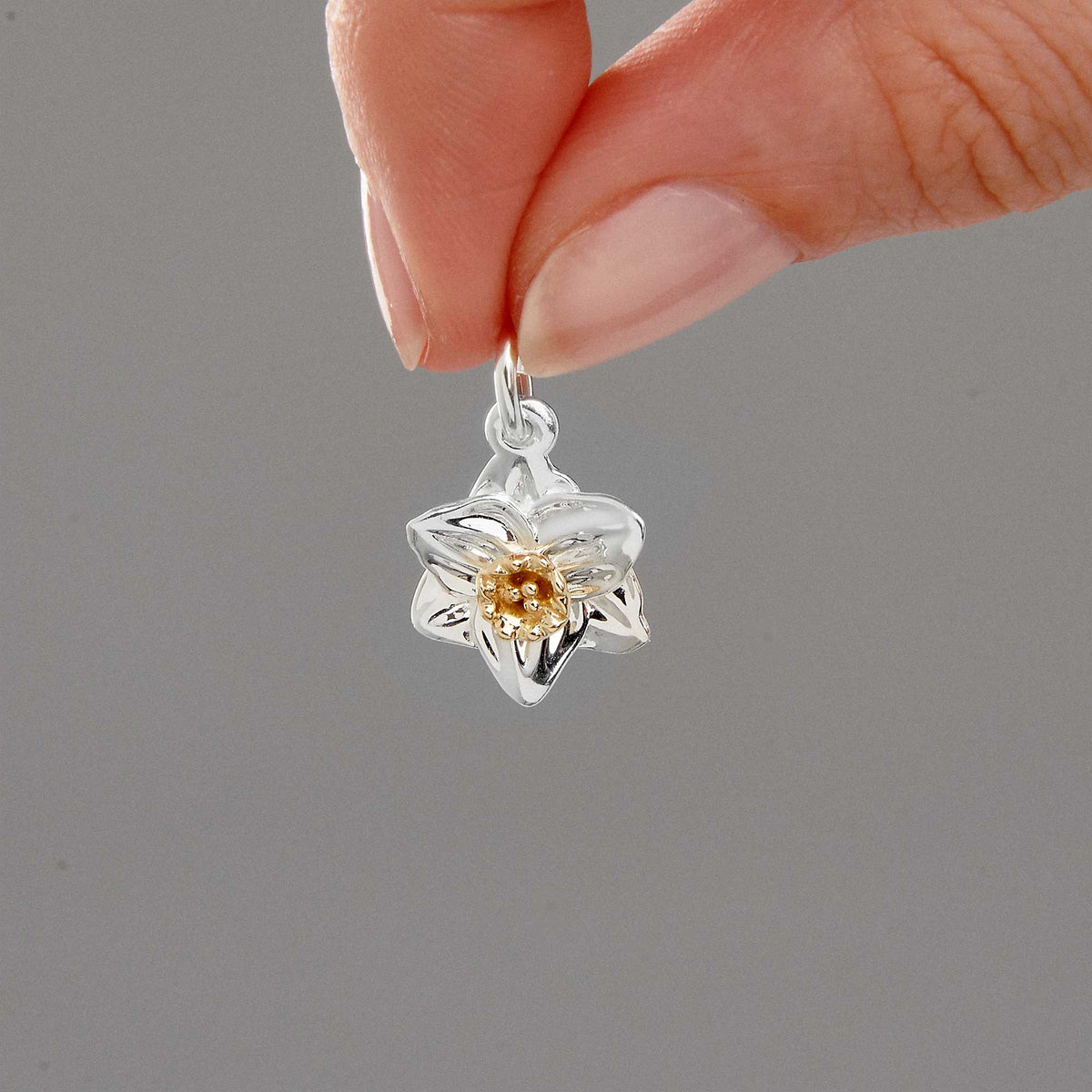 silver daffodil charm with solid gold trumpet scarlett jewellery for chelsea flower shw