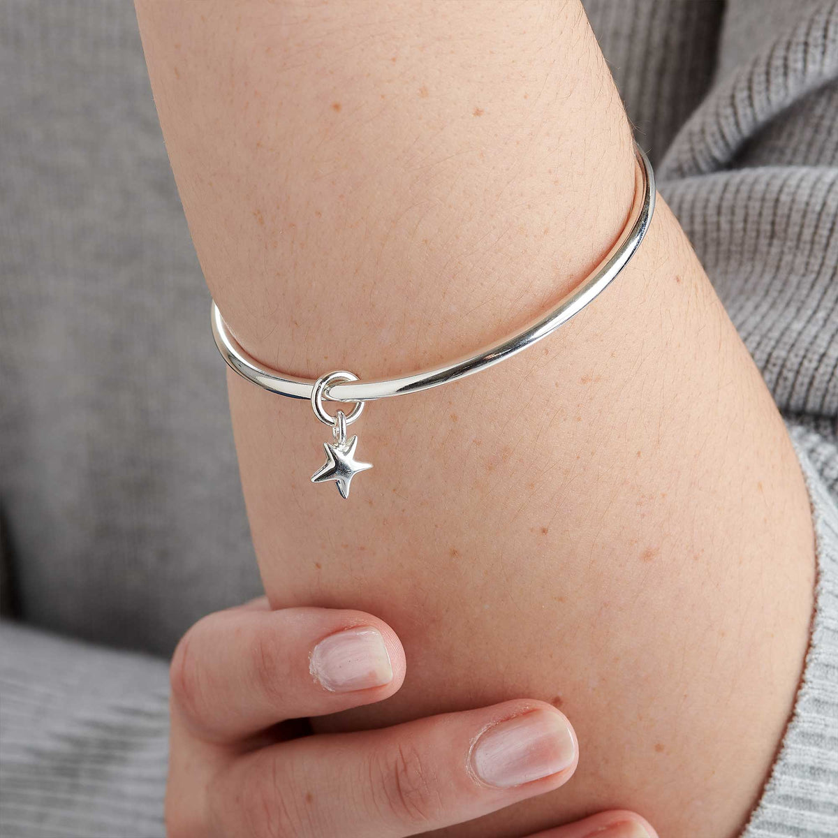 Luxurious Solid Silver Bangle with Star Charm