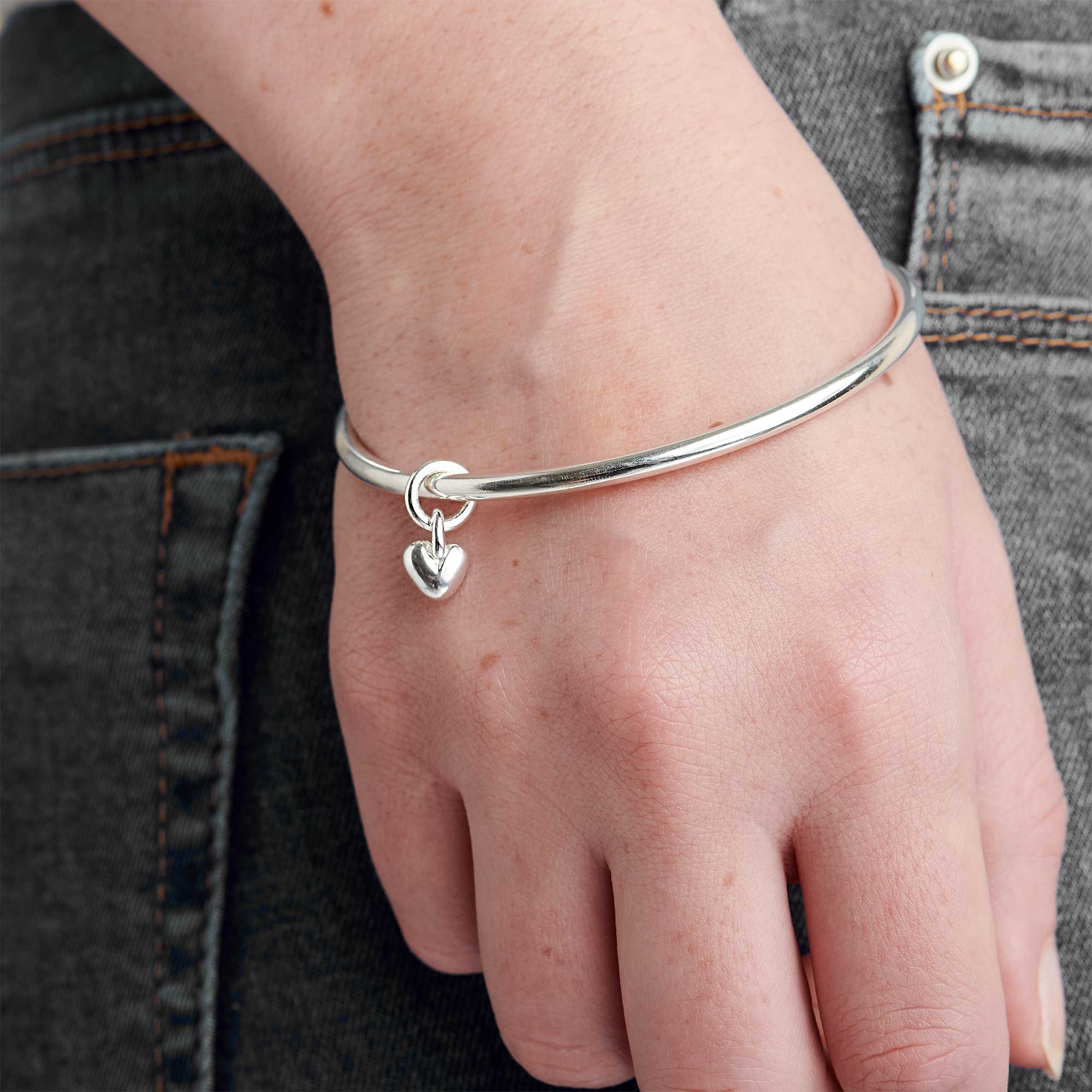 Recycled silver heart charm bangle made in UK by Scarlett Jewellery