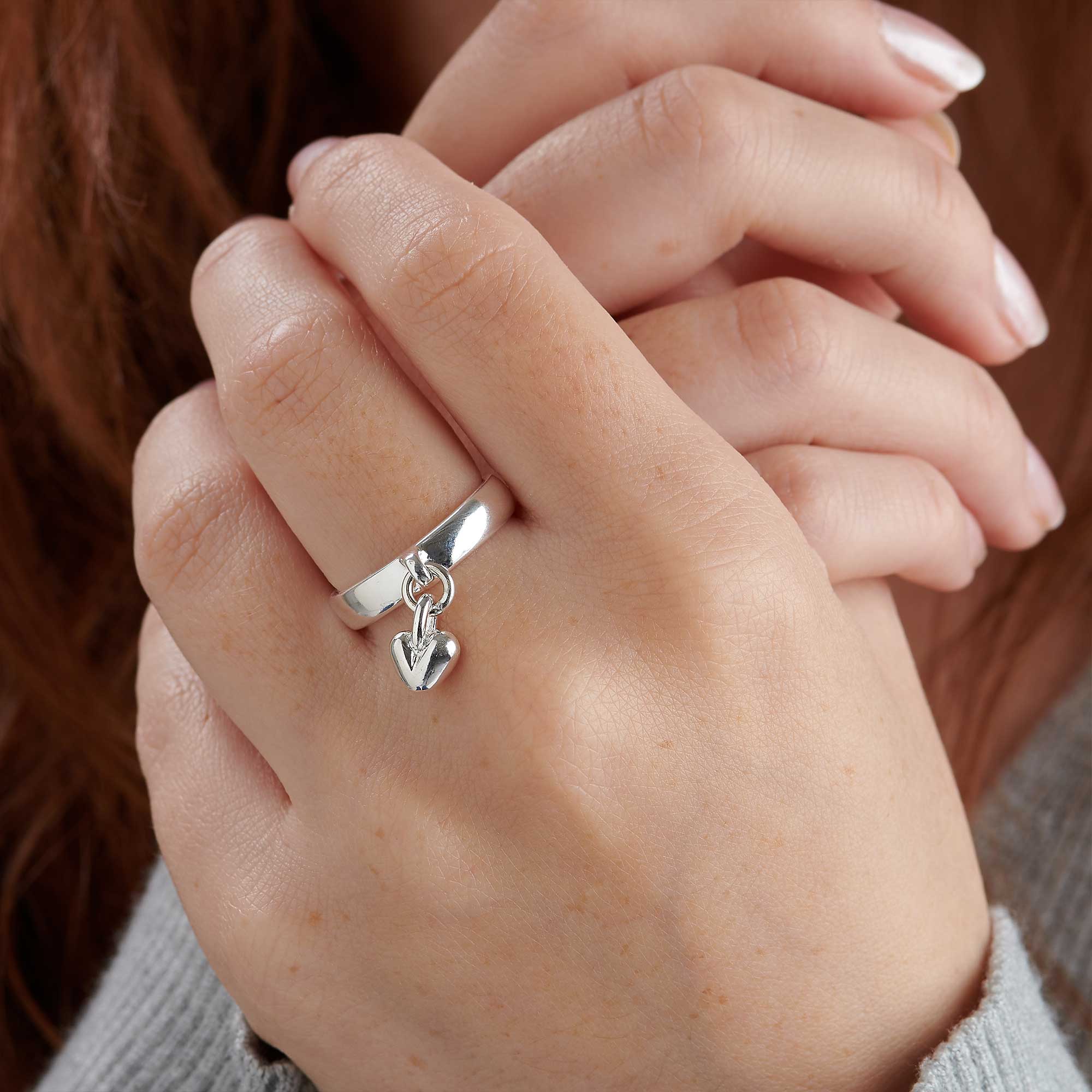 Elegant Silver Women's Ring with Dangling Heart Charm