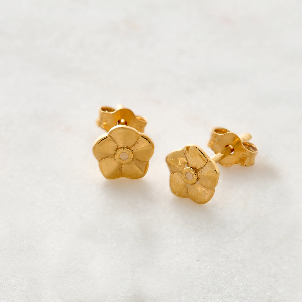gold vermeil tiny forget me not flower stud earrings scarlett jewellery chelsea flower show